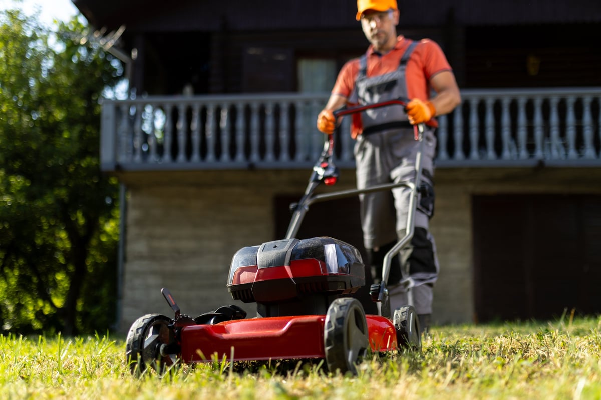 Professional lawn care technician at work